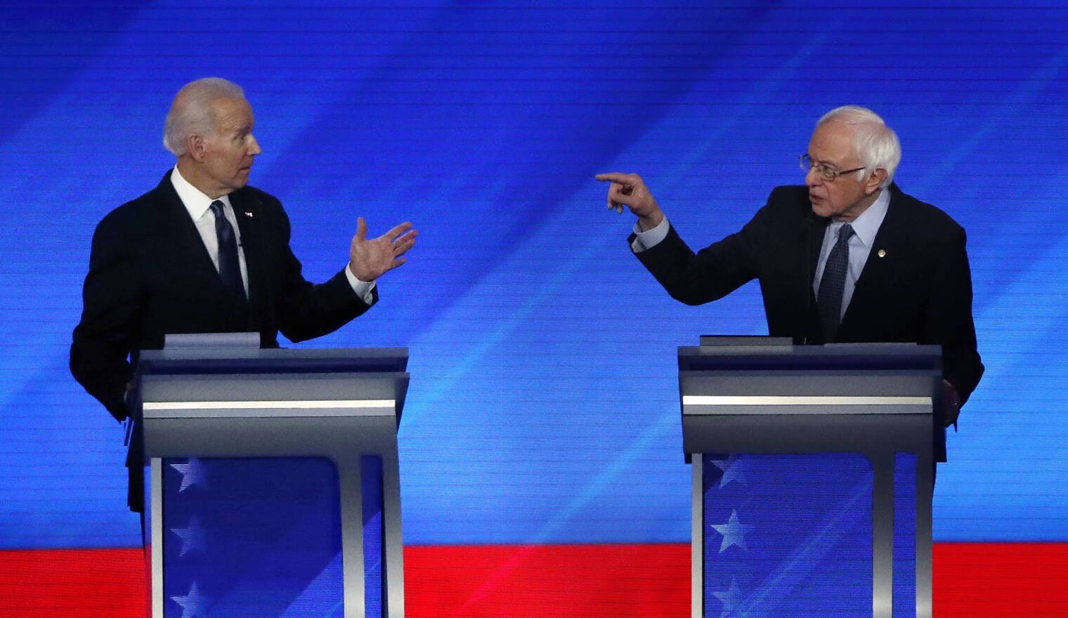 former Vice President Joe Biden, Sen. Bernie Sanders, I-Vt., in a Democratic presidential primary debate, Friday, Feb. 7, 2020, in Manchester, N.H.